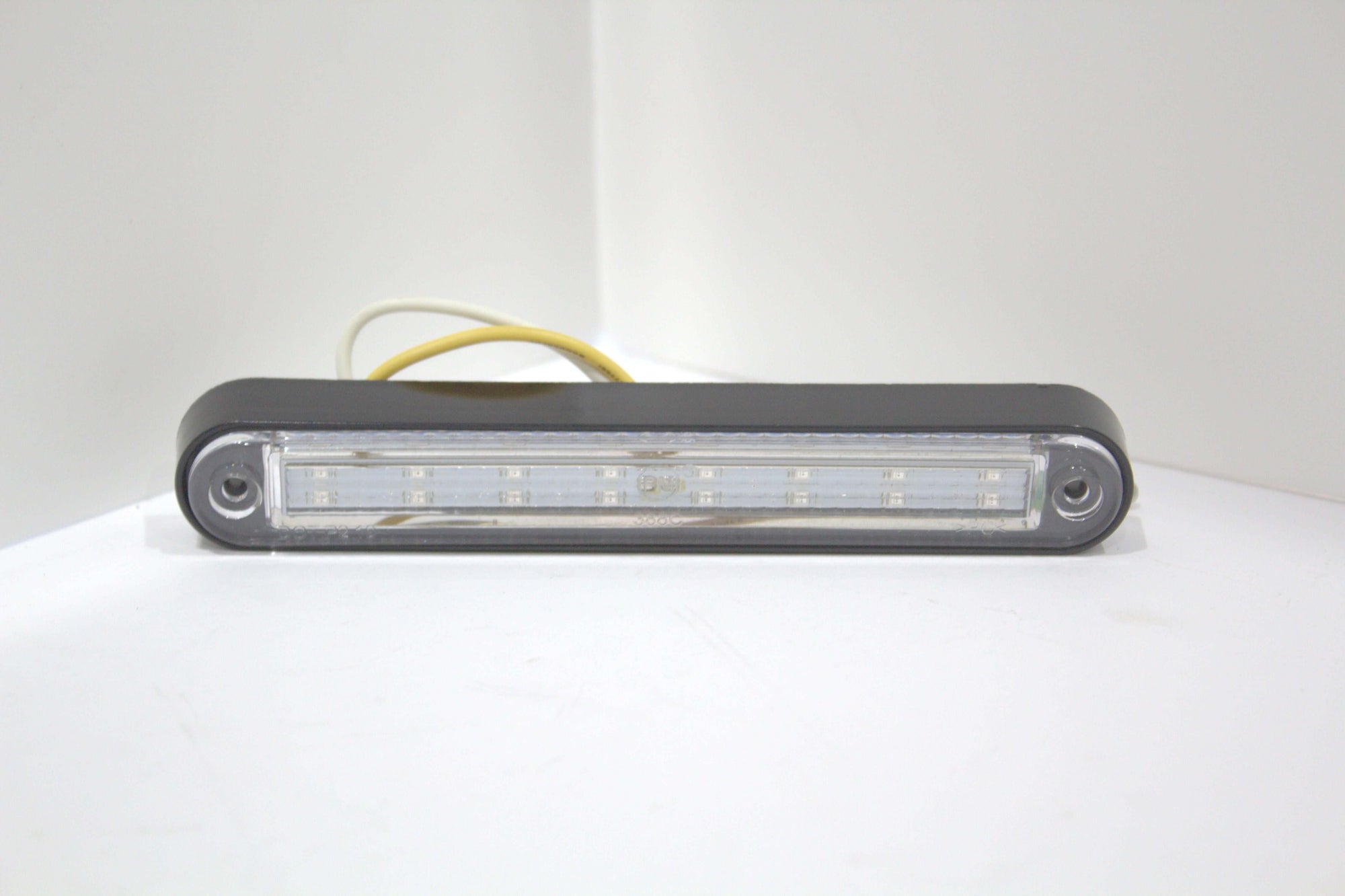 LED position marker light with a sleek black bezel, ideal for wrecker body clearance and enhanced visibility.