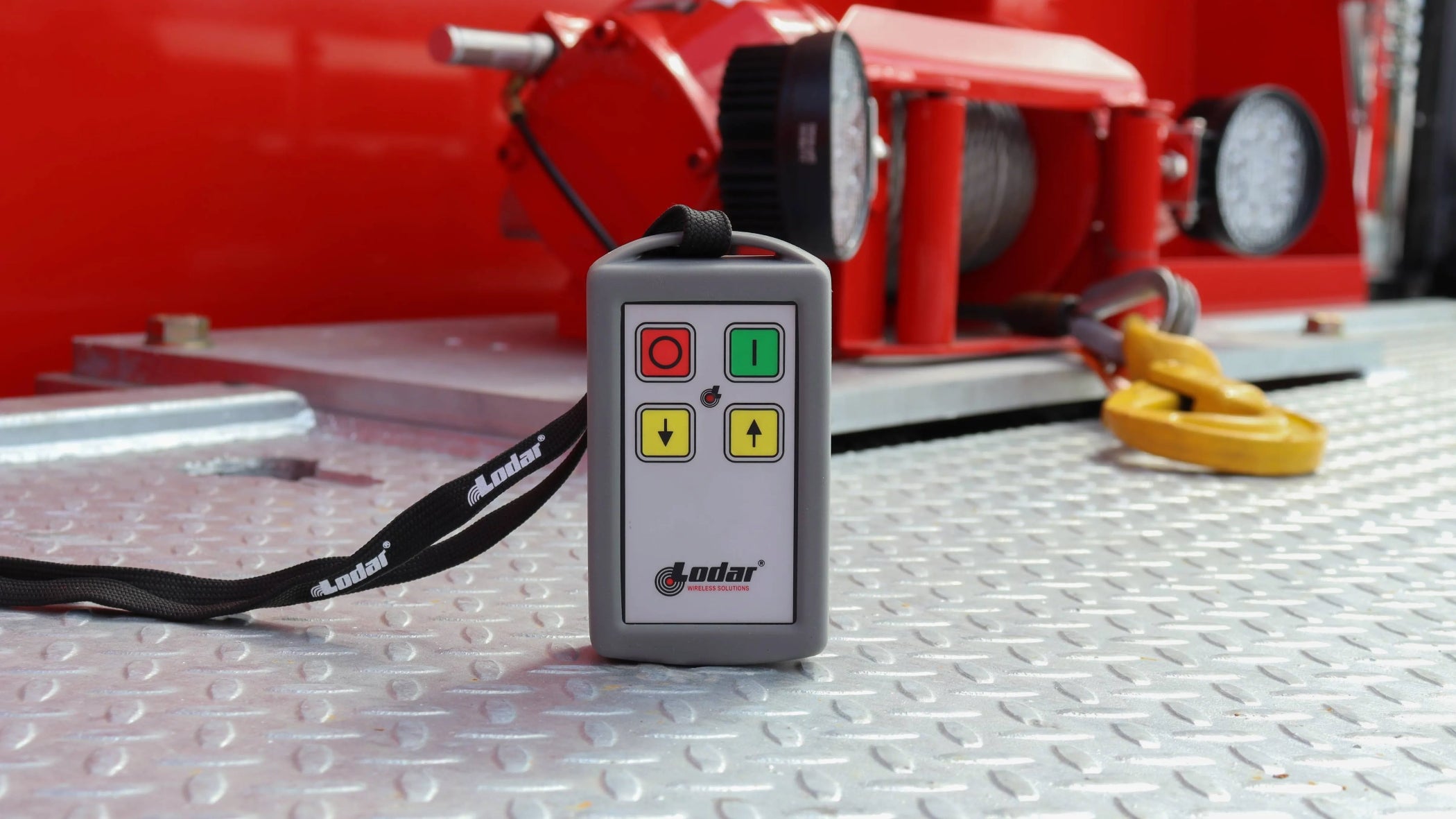 wireless remote system for controlling the bed, winch, and axle-lift on a tow truck