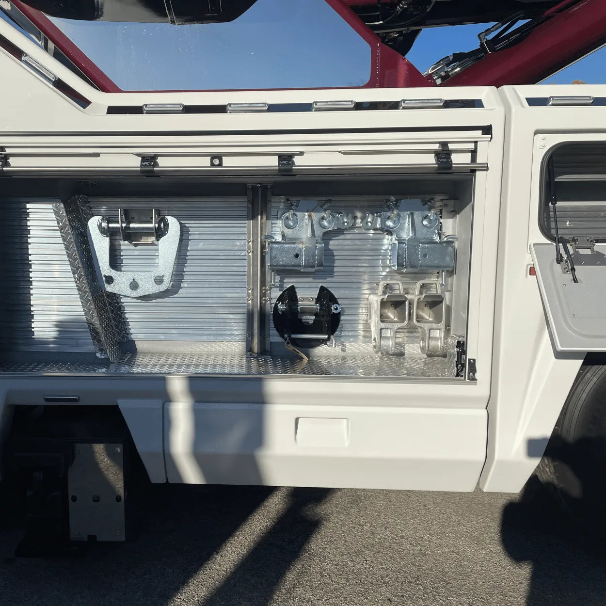 double swivel fork receivers stored inside of the toolbox of an NRC wrecker tow truck