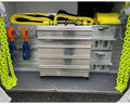5 drawer toolbox installed inside of a wrecker tunnel toolbox with towing and recovery equipment placed around it. 