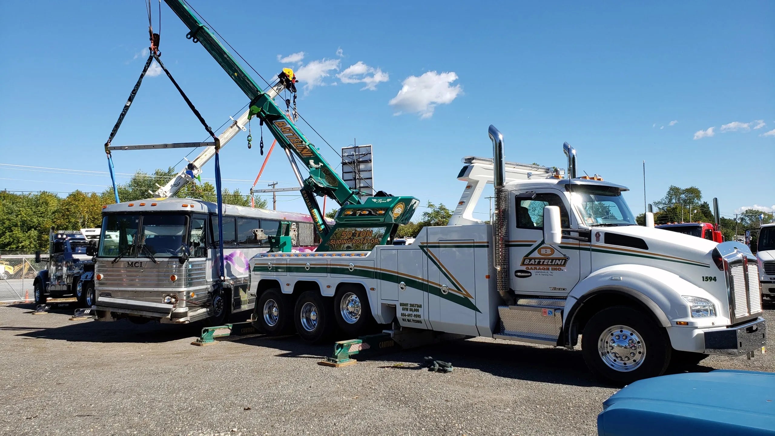 Battelini CSR50 Wrecker Lifting a Bus with snatch blocks, slings, and wire rope