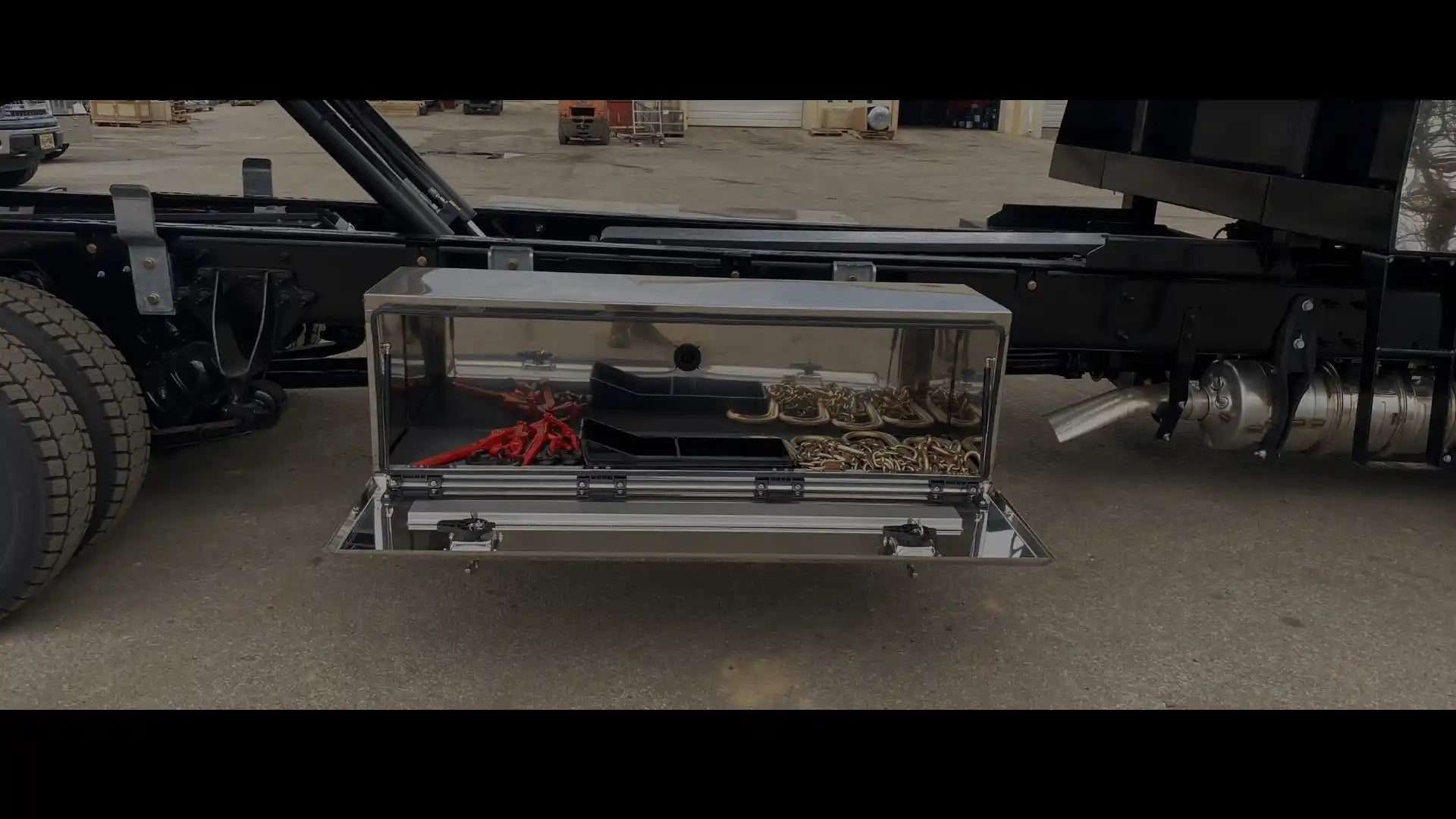 bawer stainless steel toolbox with J-hook chains, and ratchet binders inside