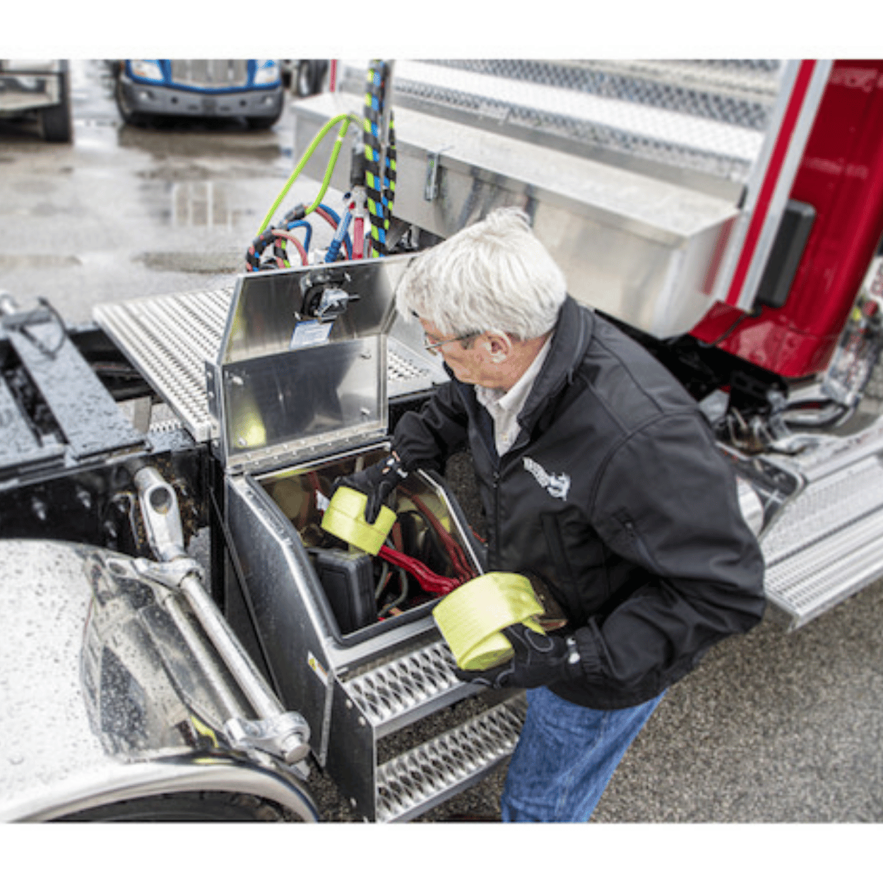 Driver using a Buyers heavy duty smooth aluminum step box to hold tie-down straps 