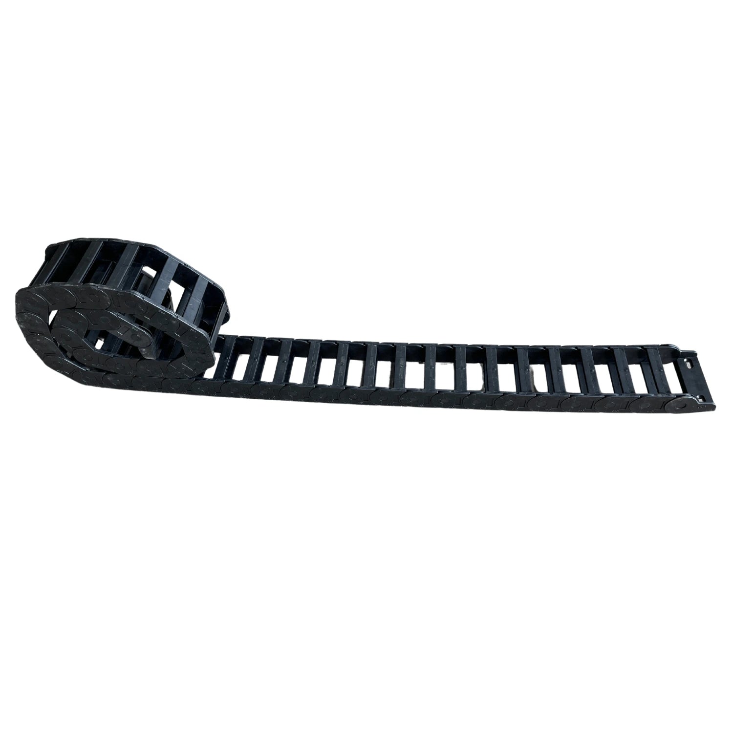 Cable e-chain used to organize and protect hydraulic and electrical lines so they don't get pinched or kinked while opening and closing the bed of a car carrier tow truck