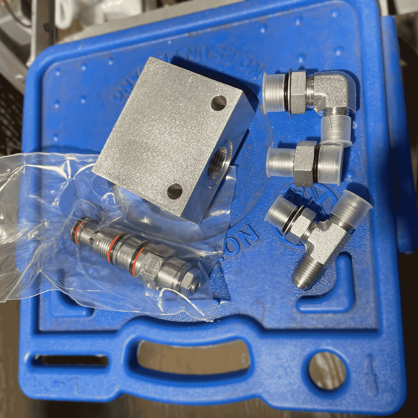counterbalance valve kit for tow-bar up-down cylinders. This kit holds pressure and keeps the tow-bar from "drifting-down"