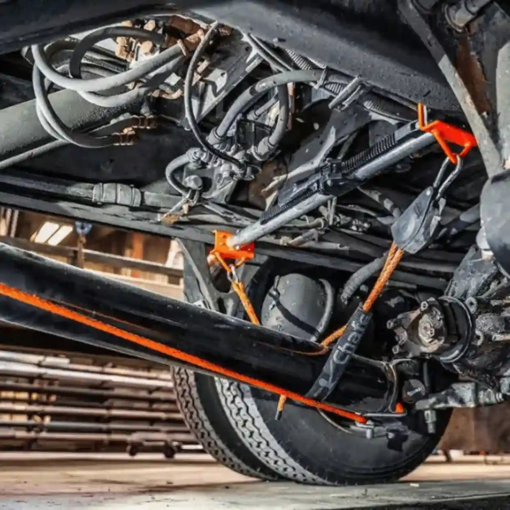 a scene depicting safeall driveline pro in action, craddling a driveshaft for easy removal - DLP100