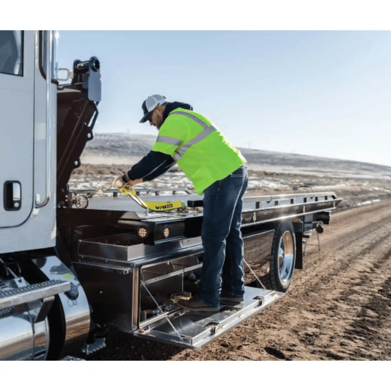 Tow Truck Operator Using In the Ditch Pro Series Toolbox Door as a Step