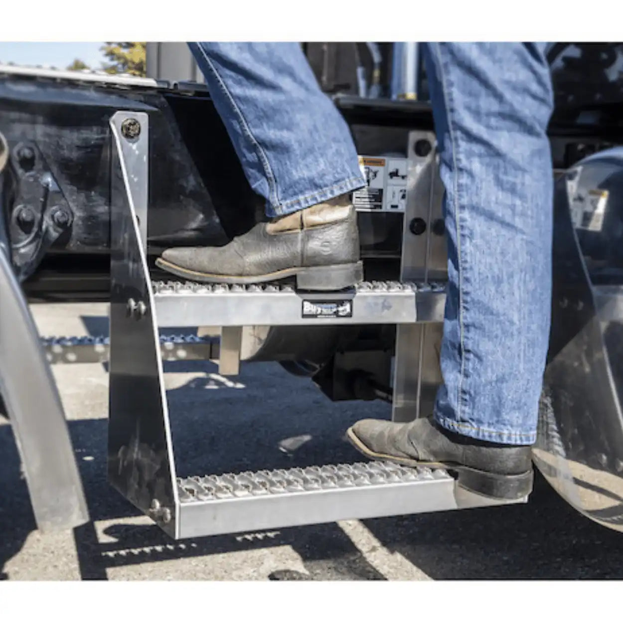 buyers products frame steps bolted on the frame of a semi truck 
