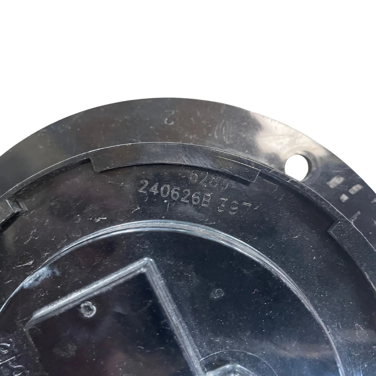 Close-up of molded date code 240626B on back of Grote 62091 LED back-up light housing