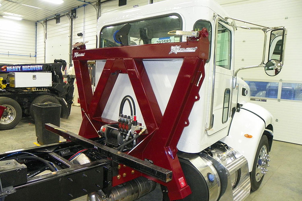 sp12000 series sidepuller from in the ditch installed just behind the cab of a car carrier truck