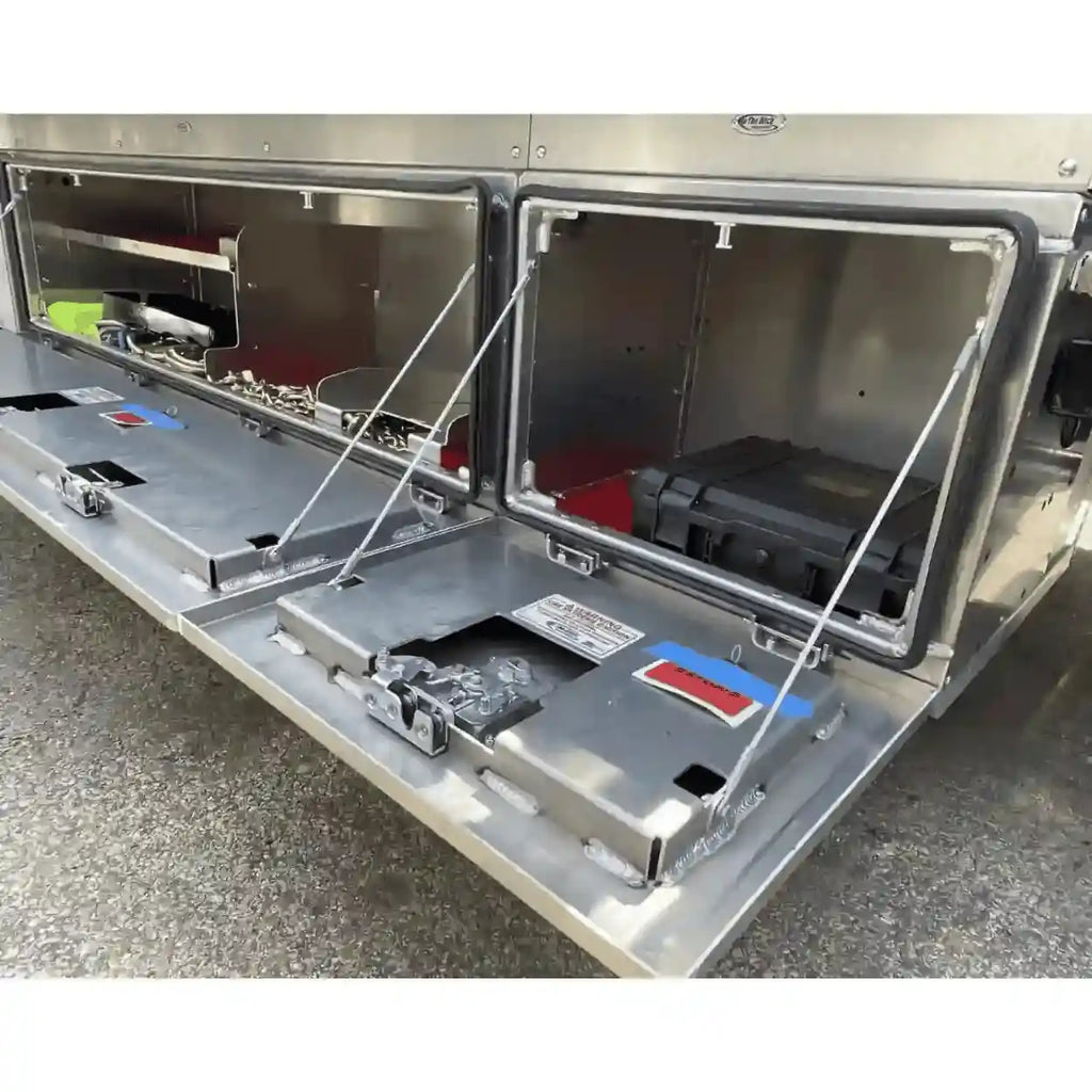 aluminum underbody toolboxes installed on NRC carrier. Includes top trays, jack bracket and highlights the 400lb. rated door