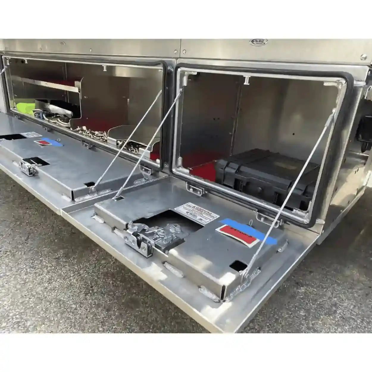 aluminum underbody toolboxes installed on NRC carrier. Includes top trays, jack bracket and highlights the 400lb. rated door