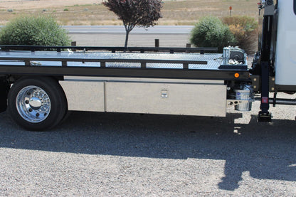 Premium Pro Series Tool Boxes by In the Ditch installed under the body of a carrier tow truck. Stainless steel mirrored finish. Top trays and trash can mount included