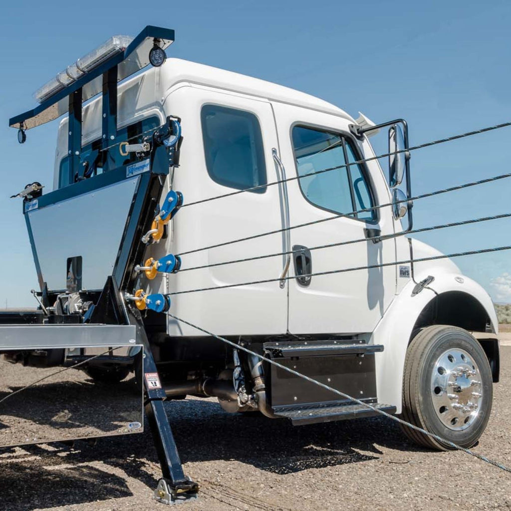an in the ditch series sp9000 sidepuller with wire lines attaches for side recovery of a vehicle