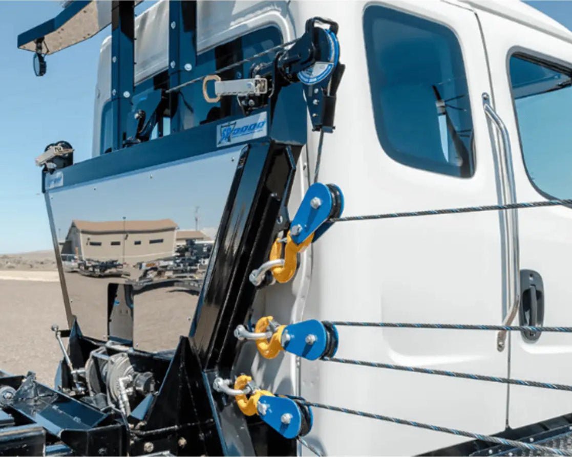 in the ditch sidepuller with snatch blocks and shackles attached to anchoring points