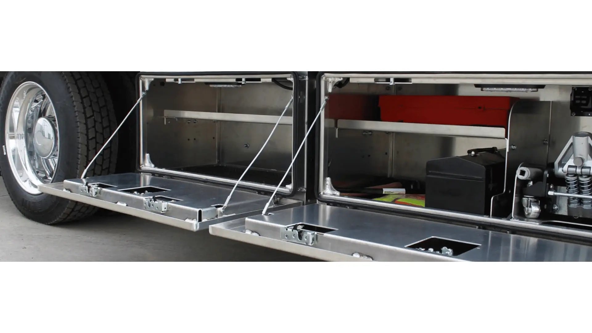 in the ditch underbody toolbox with towing equipment and jacket inside of it