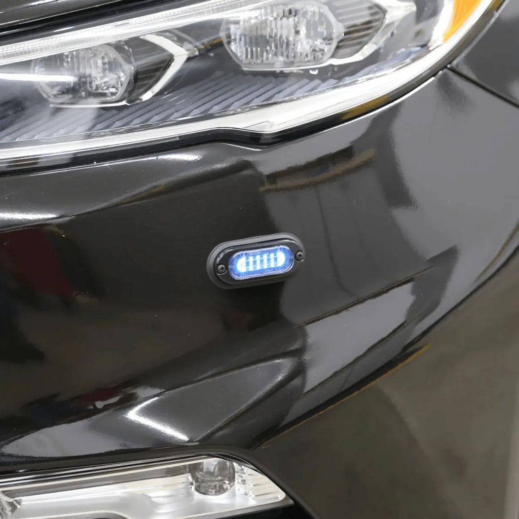 whelen mini ion led lighthead installed on the front bumber of a vehicle