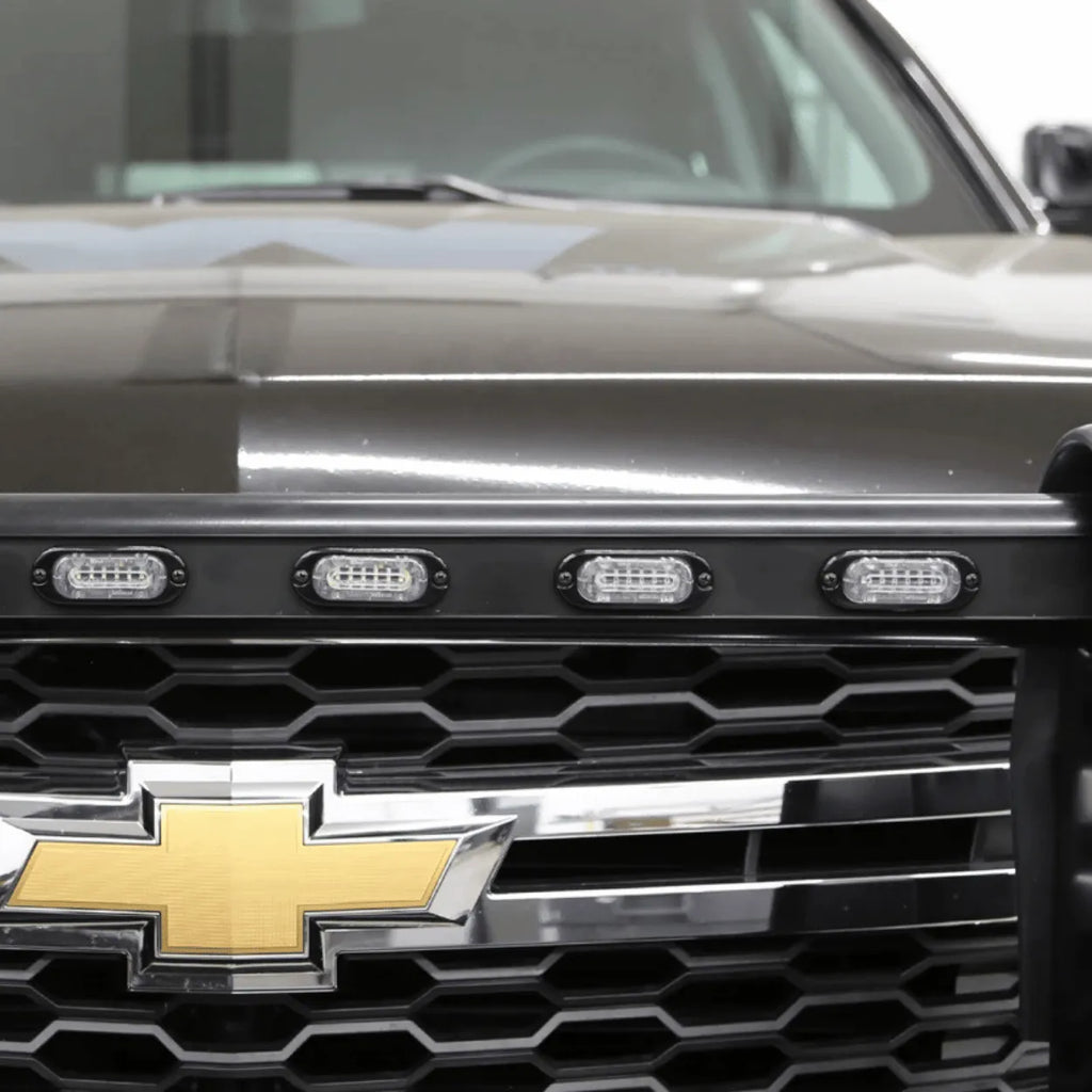 Whelen ion mini strobe lightheads installed on a grill of a truck