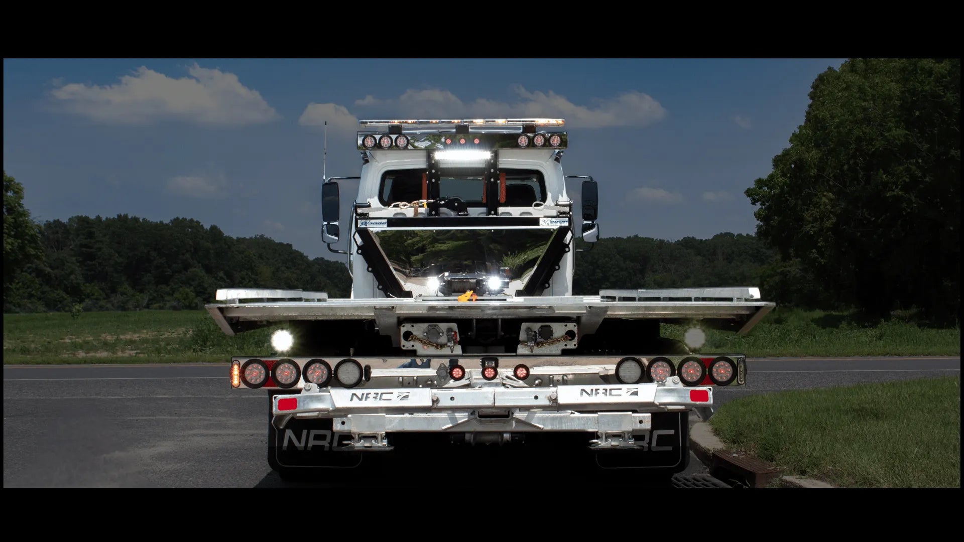 Truck lights shinning on a 20TB NRC Carrier with Sidepuller