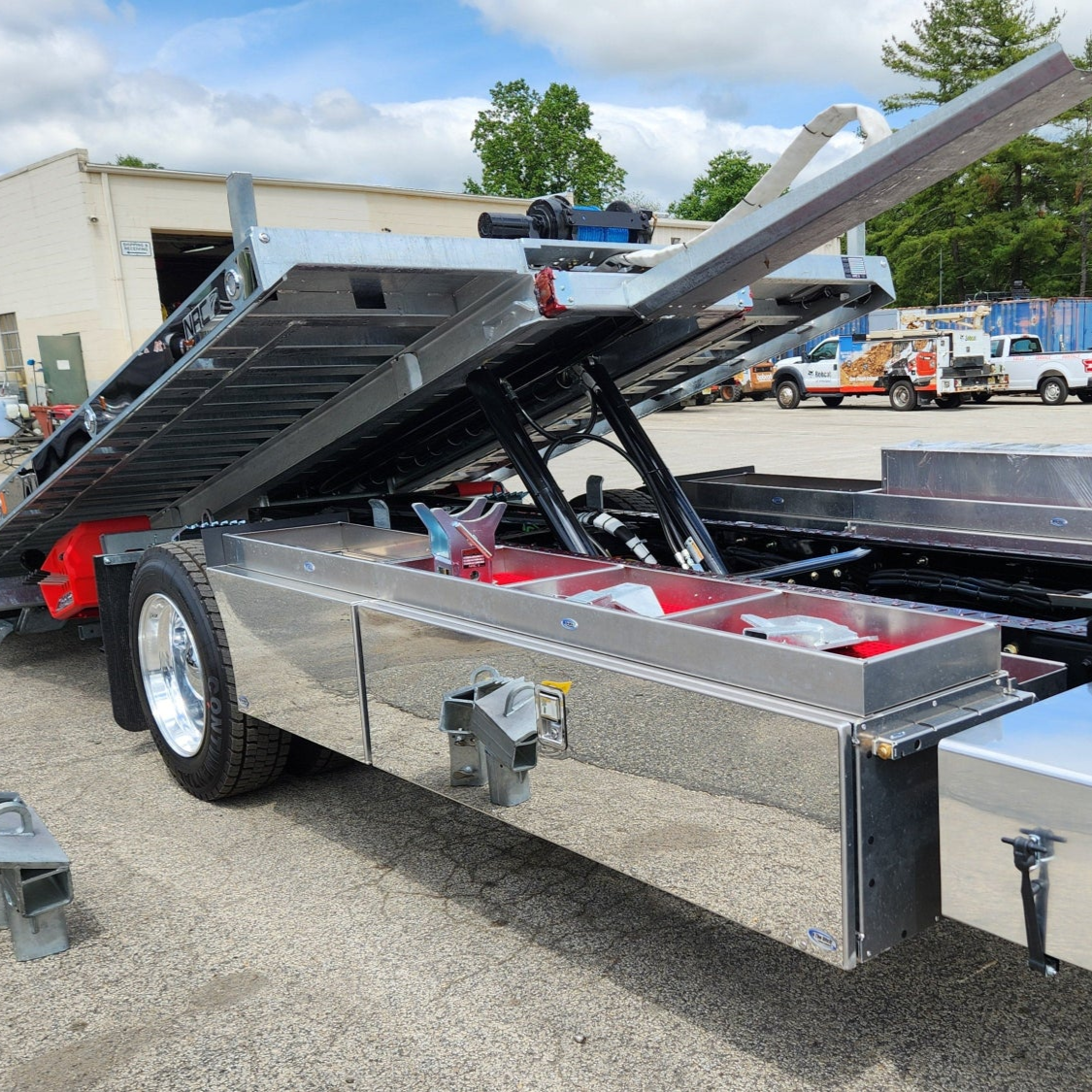 highlighting truck storage solutions from in the ditch towing. underbody toolbox, storage fender, lumber baskets, and top trays with hitch receiver and bed guides