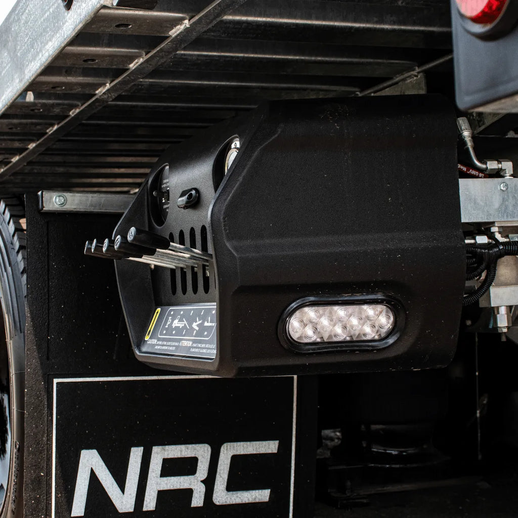 control box with control levers and oval light on NRC car carrier tow trucks