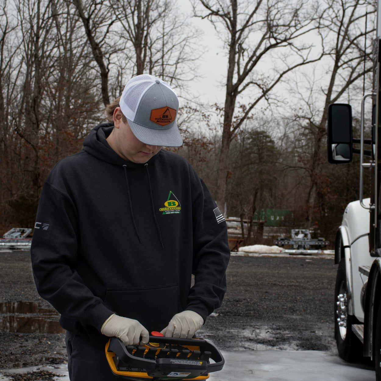 operating the boom of an nrc wrecker while wearing the Battelini Trucking Sweatshirt