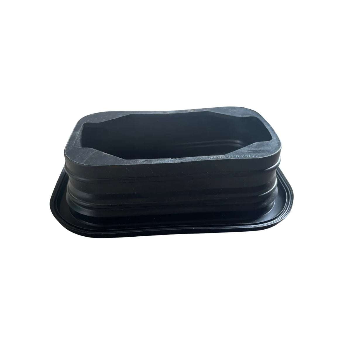 Side view of Optronics A33GB rectangular grommet showing ribbed body and mounting flange