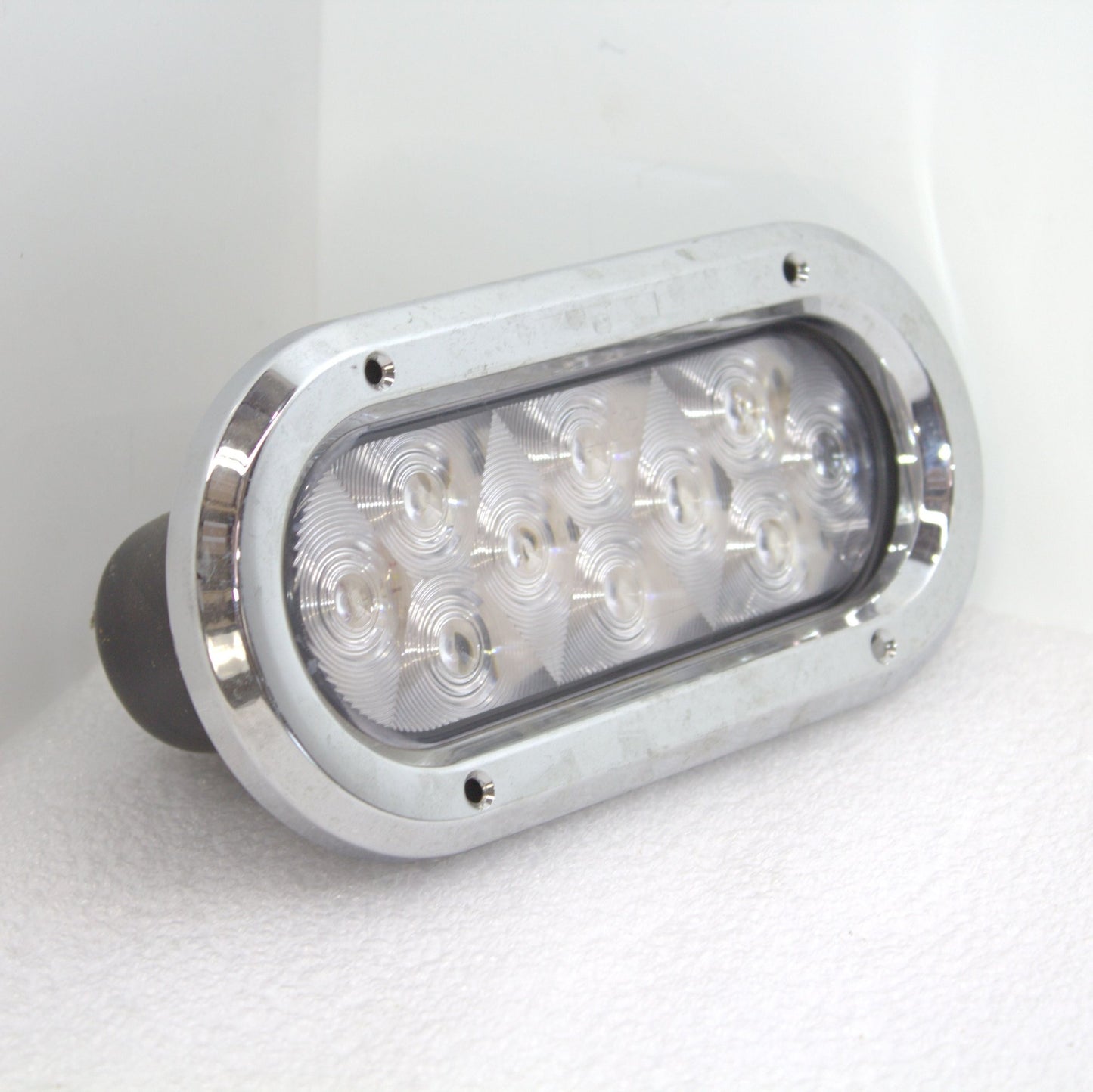 oval white LED lights with rubber grommets and chrome bezels