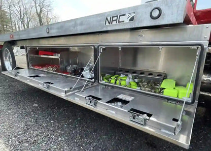 premium underbody tool boxes from In the Ditch. two toolboxes and a storage fender installed on an NRC car carrier.