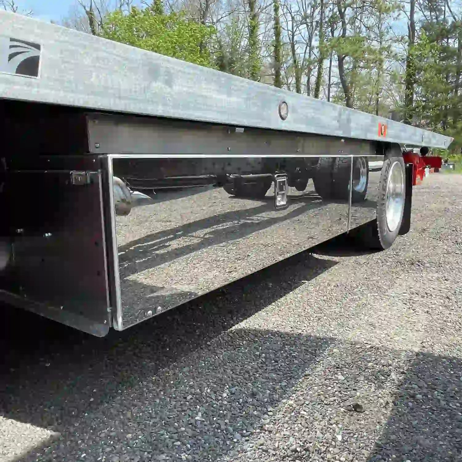 Premium pro series underbody toolbox and storage fender installed on an NRC car carrier