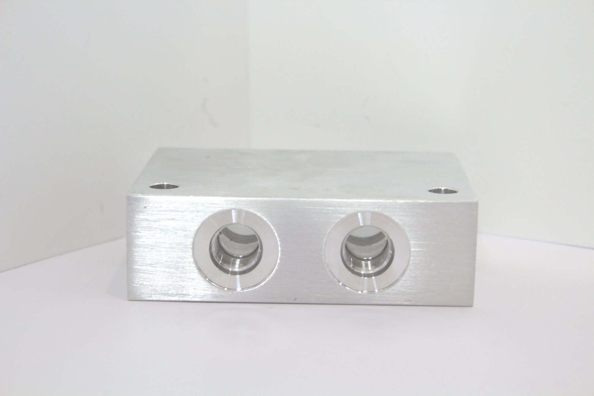 Safety Block Cross Pilot Manifold YEI with dual ports for hydraulic systems, ideal for wrecker repair parts and versatile applications.