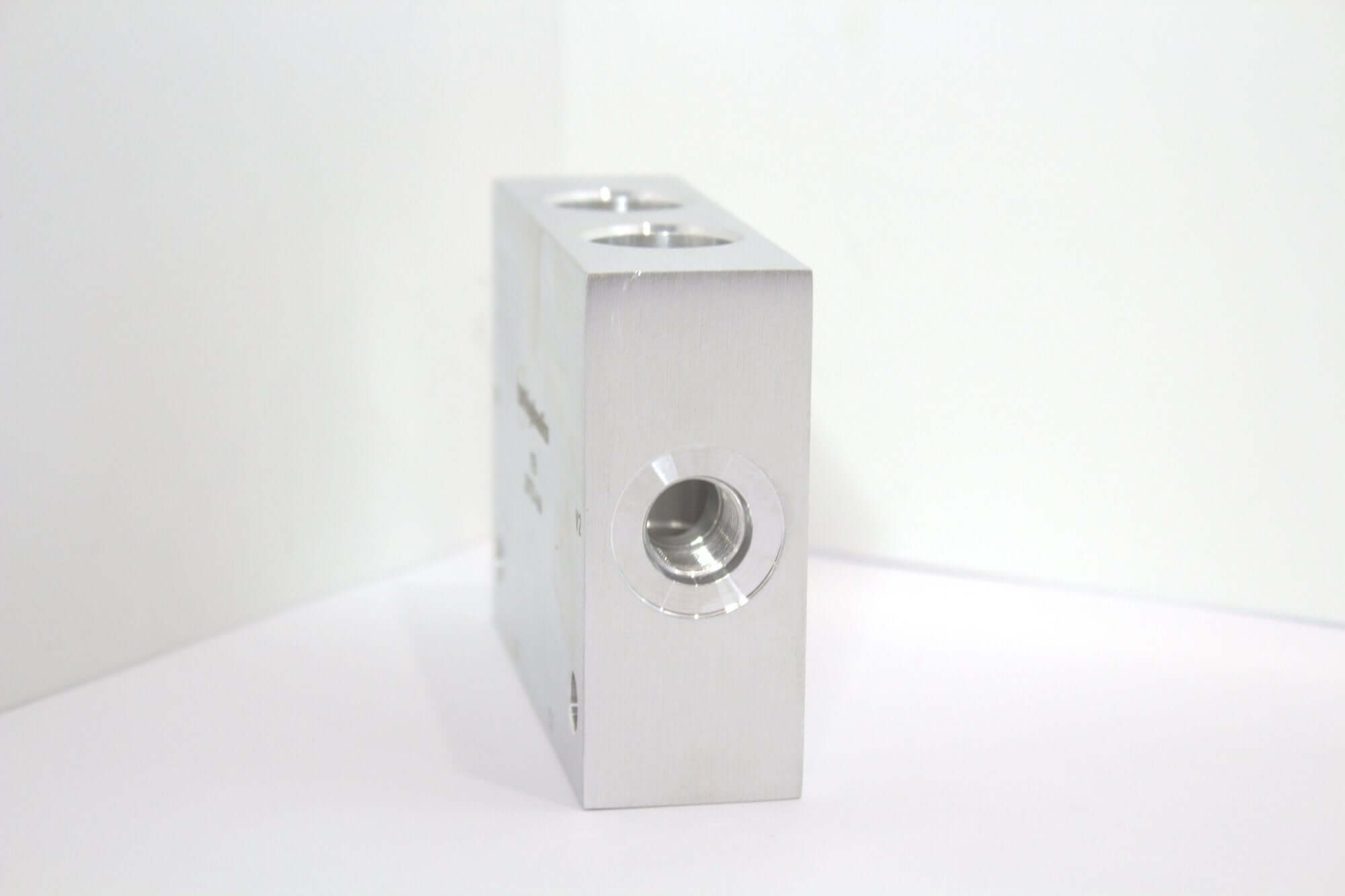 Safety Block Cross Pilot Manifold YEI, aluminum design for hydraulic systems and wrecker repair parts.