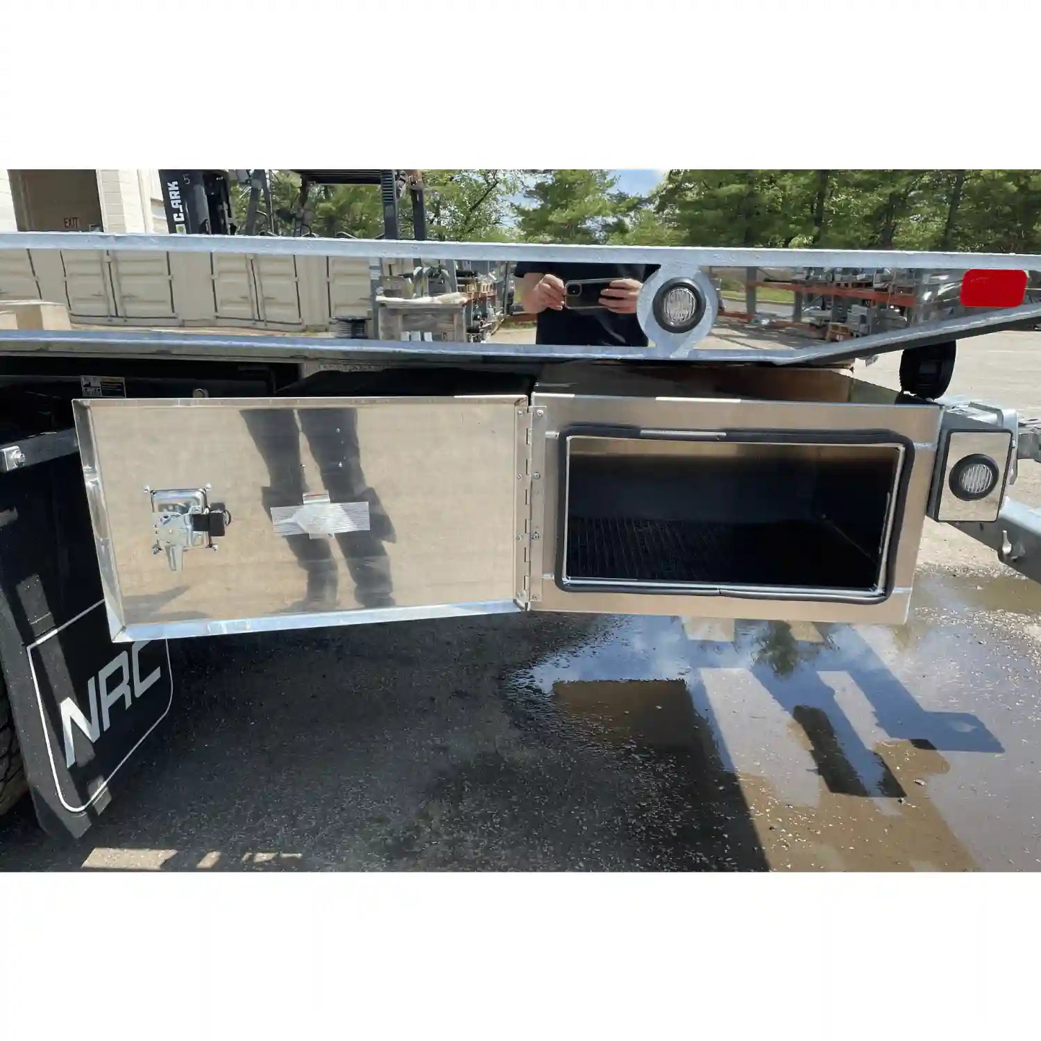 stainless steel rear toolbox with an open swing door. Brunner fabrication