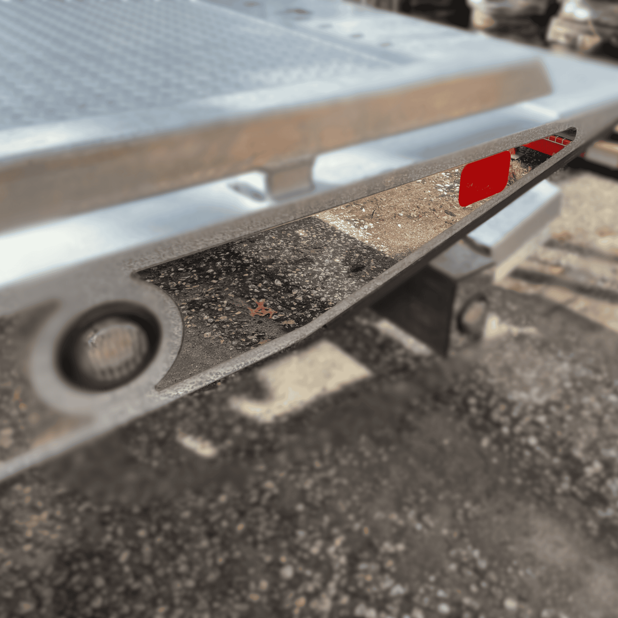 stainless steel trim piece for the backside of the deck on a car carrier