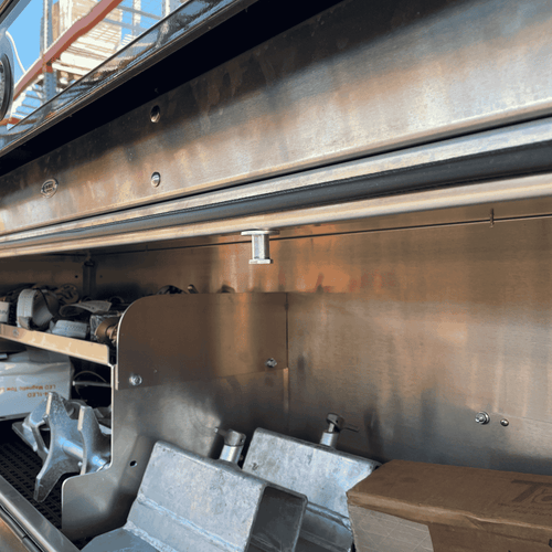 striker assembly for In the Ditch Pro Series toolboxes. The latch locks around the striker to keep the door closed