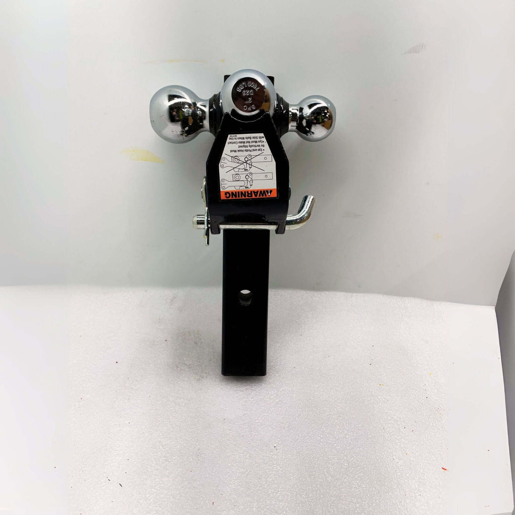 a tri-ball hitch with pintle hook, designed for 2 1/2 inch receivers. This triple ball hitch is robust towing equipment for versatile hauling needs
