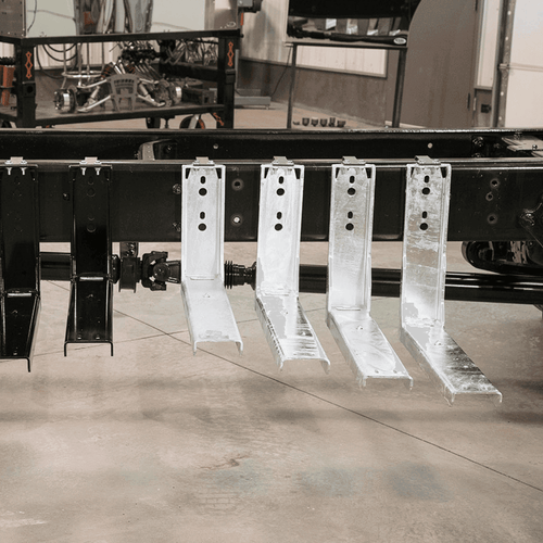 Multiple 18-1/2'' Quick Mount toolbox brackets installed on a truck chassis, demonstrating easy, jack-free mounting system.
