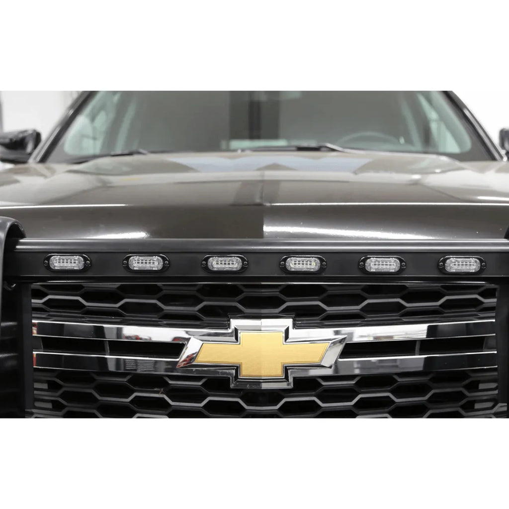 whelen mini ion led lightheads installed on the grill of a truck