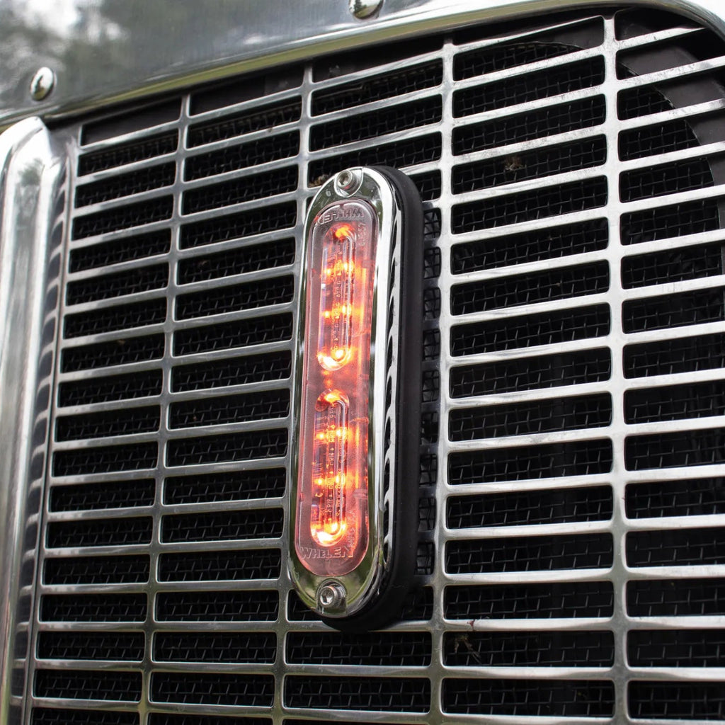 Whelen T-Series Ion Red Strobe Light mounted on the grill of an NRC carrier