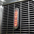 Whelen T-Series Ion Red Strobe Light mounted on the grill of an NRC carrier