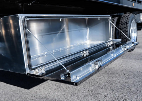 a picture of a workman series underbody toolbox installed on a rollback tow truck